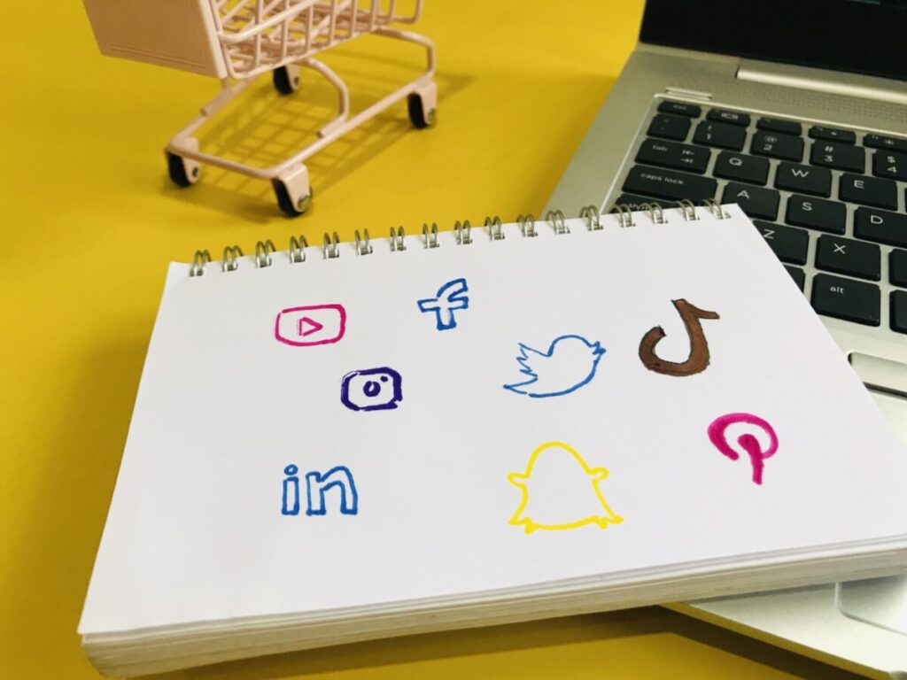 social media icons on a notebook for social content marketing