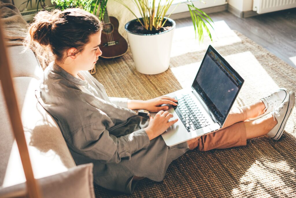 content marketer working at home using her laptop