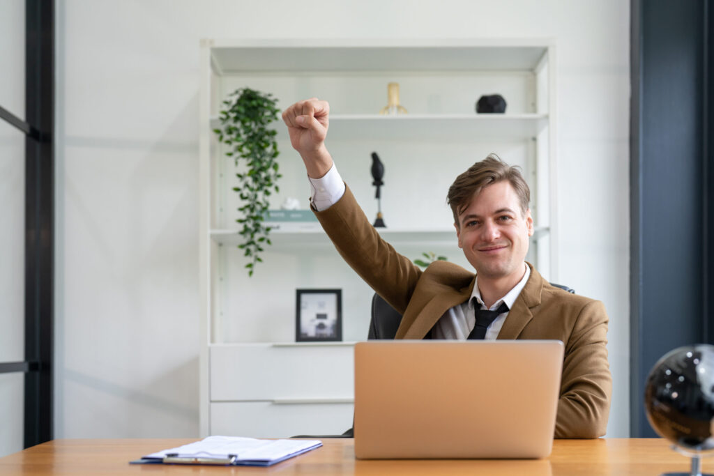 A man celebrating for success with its b2b email marketing client.
