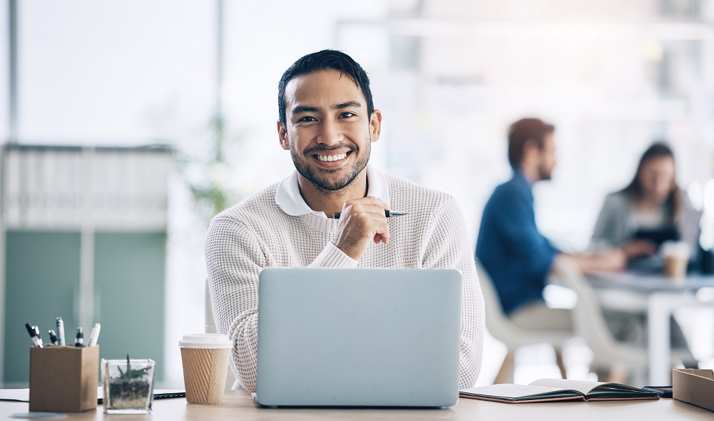 A man working as copywriter smiling