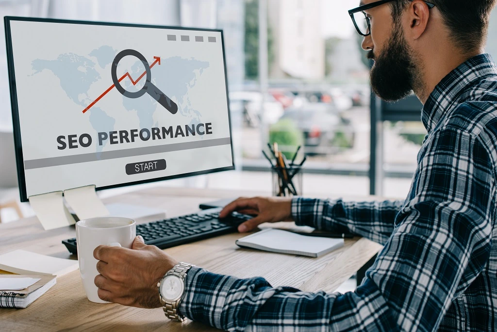Man Analyzing Seo Performance, Demonstrating Why Seo Is Important For Online Visibility And Growth