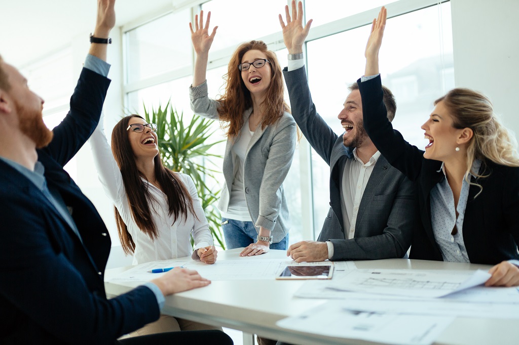 a group of business people celebrating the success of their direct response marketing