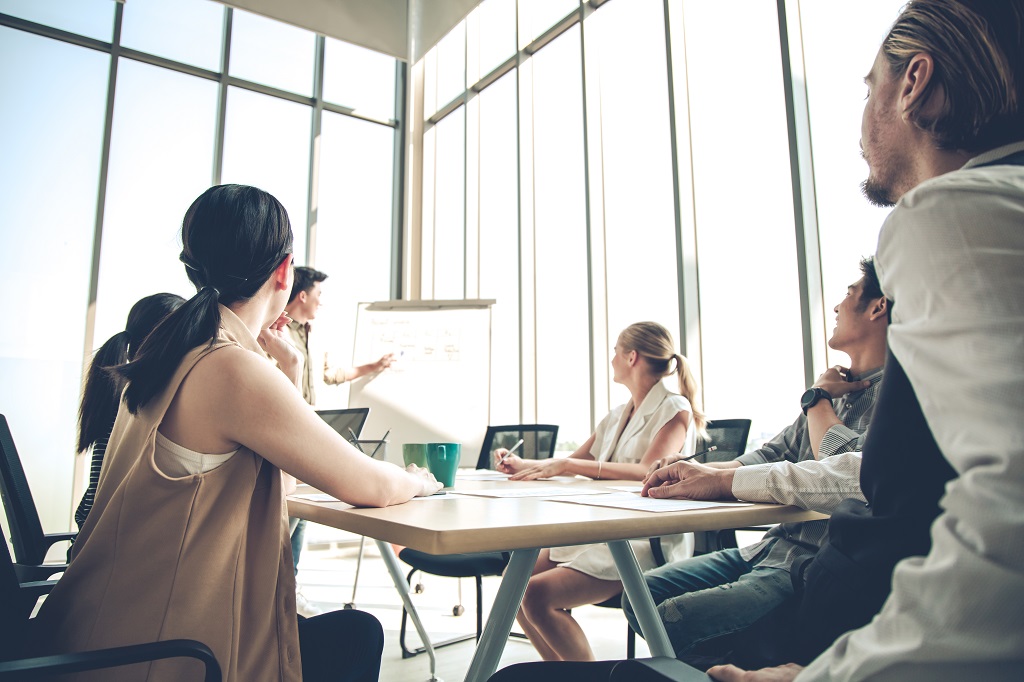 a group of marketers analyzing the results of their direct response marketing